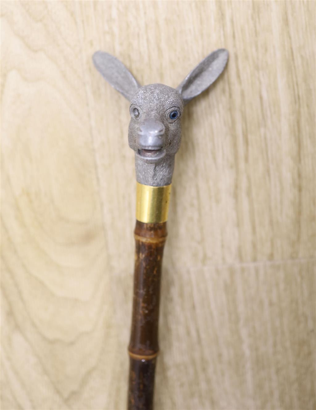 An articulated Brigg donkey head parasol, length 91cm